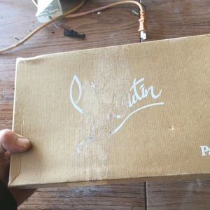 Red bottom shoes.  Very used